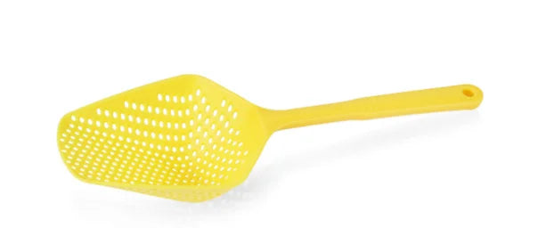 Yellow plastic scoop on a white background