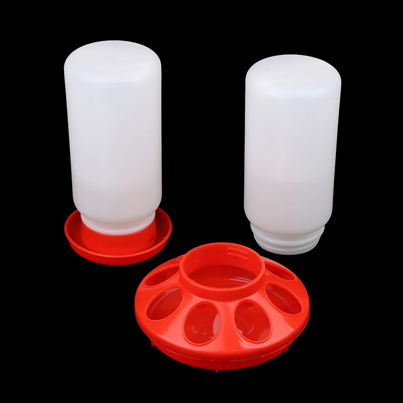 Two white plastic poultry feeders with red bases on a black background