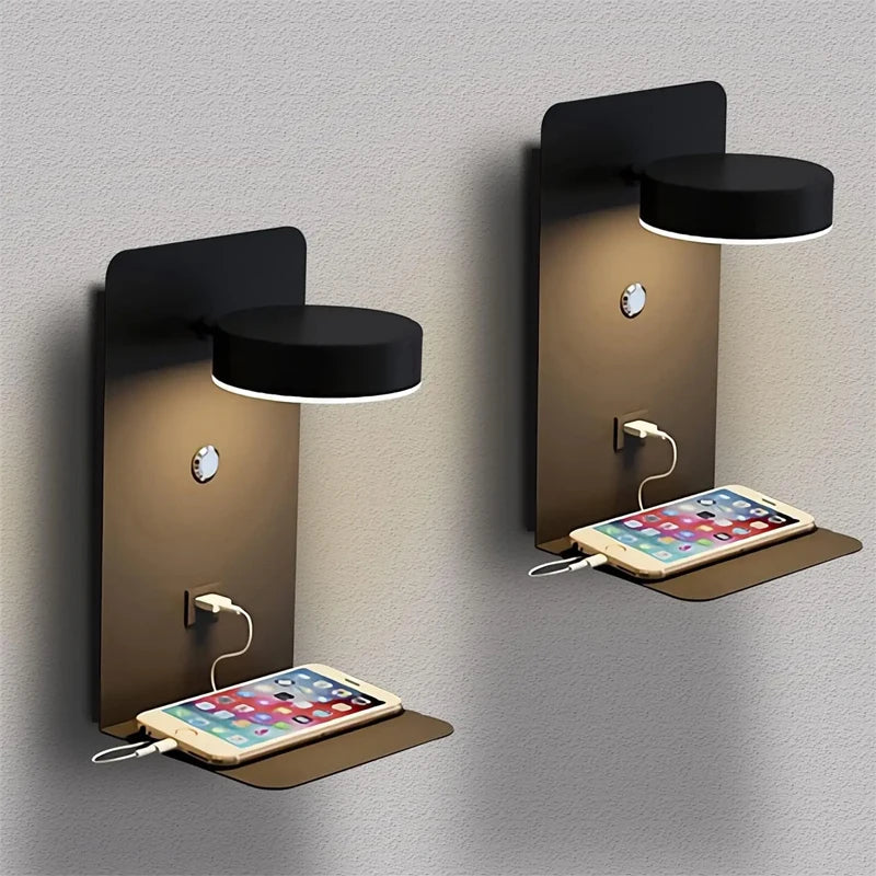 Two wall-mounted lamps with built-in charging ports for smartphones on a gray background.