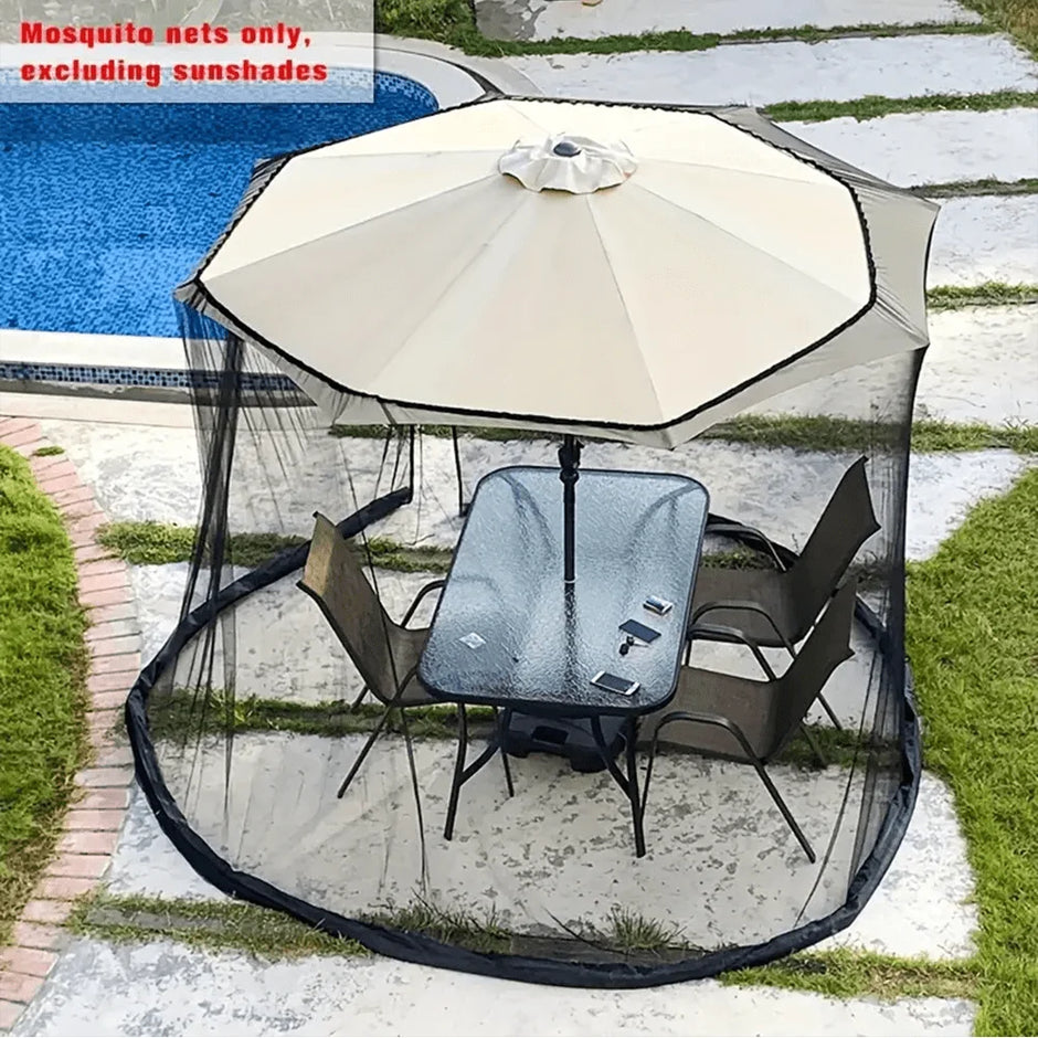 Outdoor umbrella with mosquito netting over a patio set by a pool.
