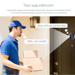 Man delivering packages with a two-way intercom system displayed on screen