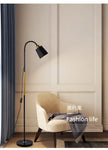 Floor lamp and chair in a room with 'Fashion life' text