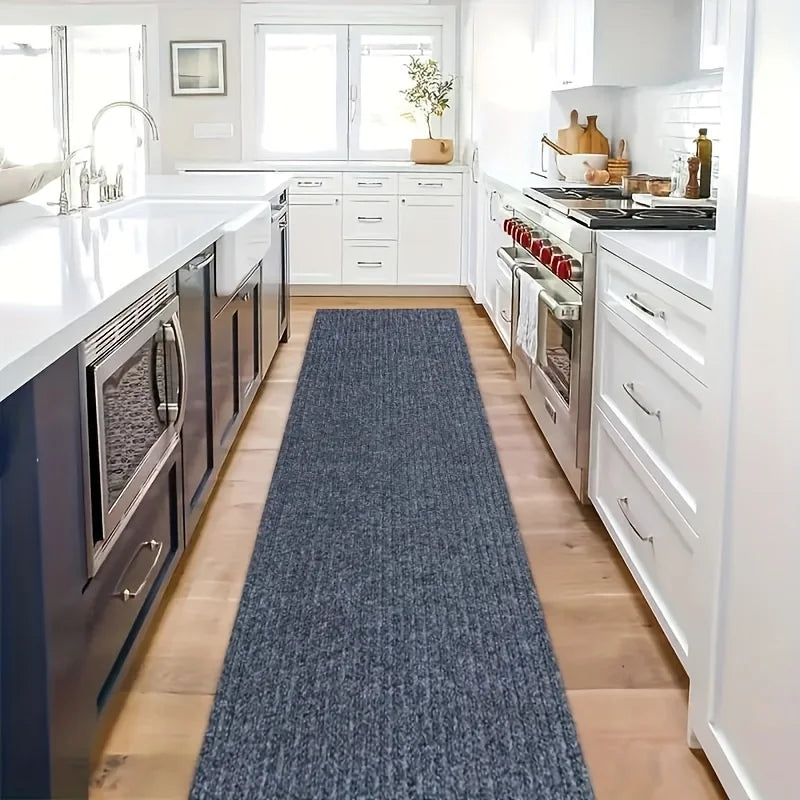 Modern kitchen with a long blue runner on the floor