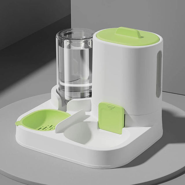 Pet feeder and water dispenser with green accents on a gray surface