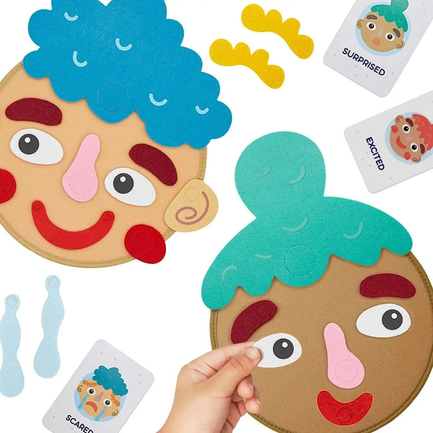 Colorful foam face masks with different expressions and a hand holding one of them.