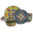 Set of colorful ceramic plates with floral patterns on a white background