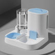 Pet water and food dispenser with blue accents on a gray surface