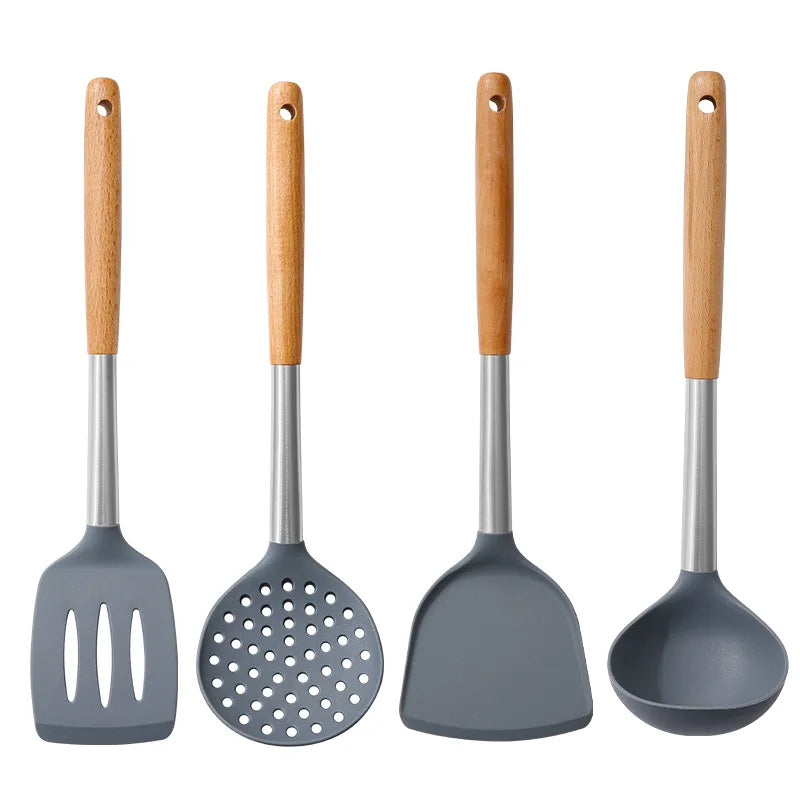 Set of four gray kitchen utensils with wooden handles on a white background