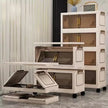 Multi-level storage unit with transparent doors in a room setting.