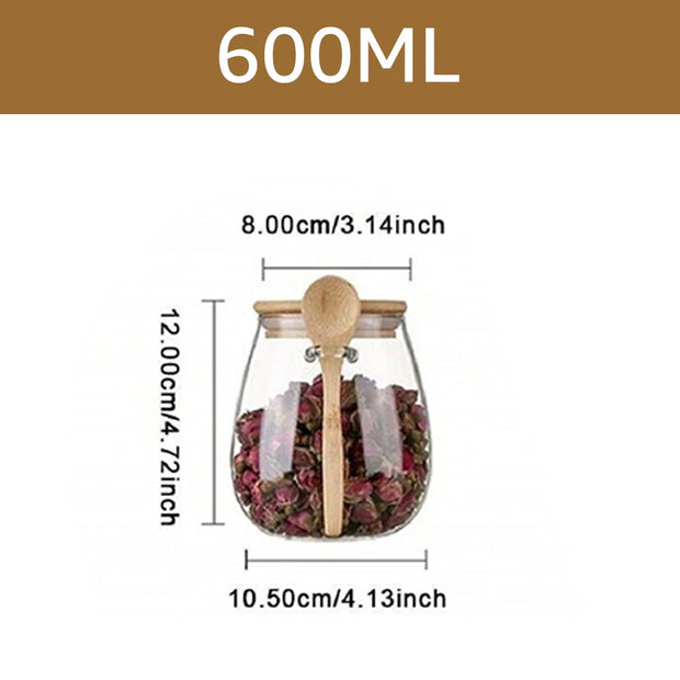 Glass jar with wooden spoon and tea bags, labeled 600ML with dimensions on a white background.