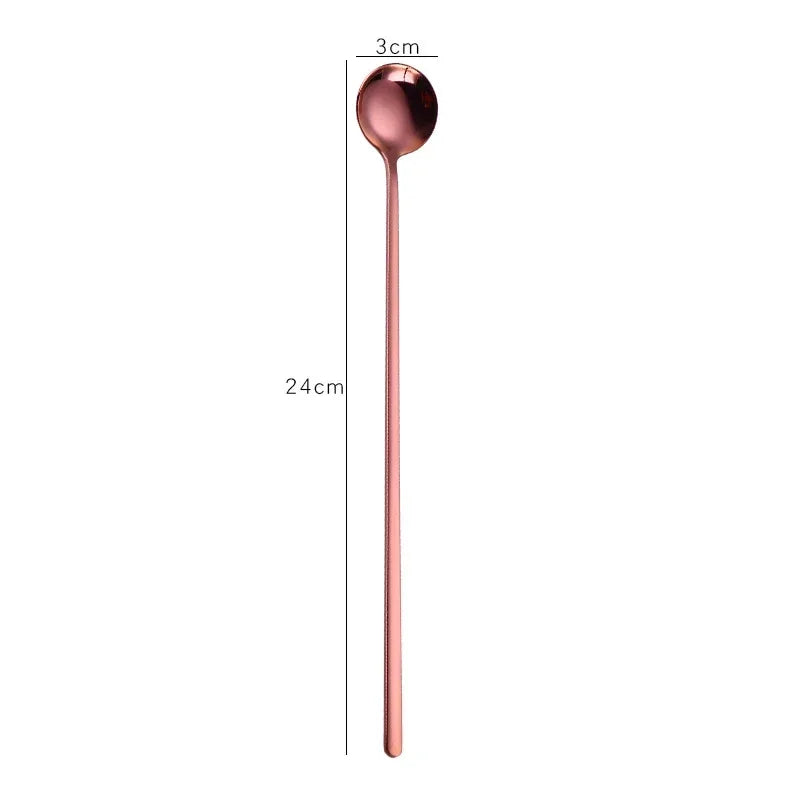 Rose gold spoon with measurements on a white background