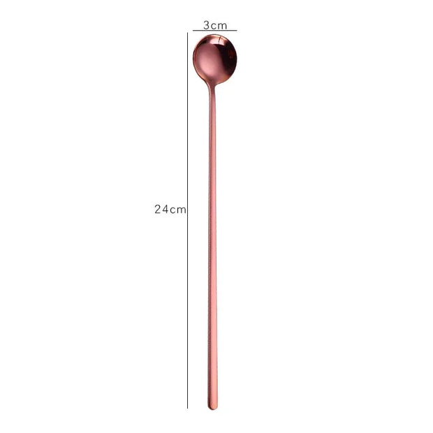 Rose gold spoon with measurements on a white background