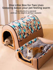 Pet bed with a patterned roof and open side, showing two dogs inside.