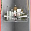 Corner shower caddy with toiletries on a gray wall