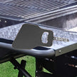 Black grill mat on a grill with a grassy background