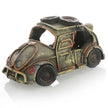 Vintage-style toy car with a rusty appearance on a white background