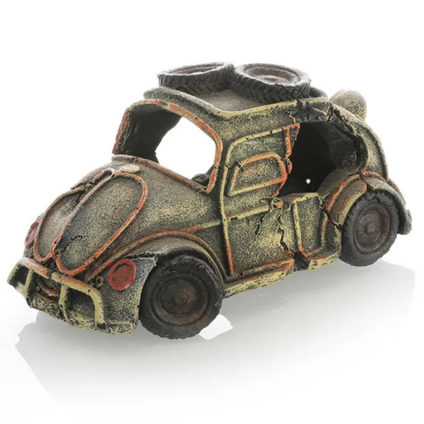 Vintage-style toy car with a rusty appearance on a white background