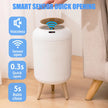 White trash bin with sensor and voiceless features on a wooden floor.