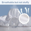 White diaper with breathable material and text 'Breathable but not stuffy' on a blue background.