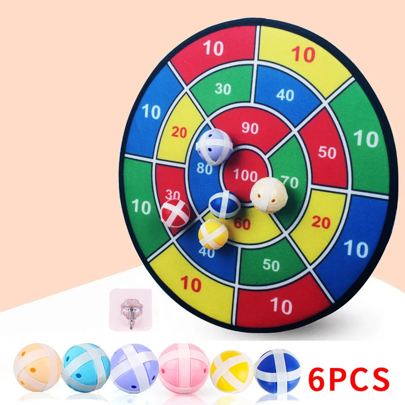 Colorful dartboard game with six colorful darts on a beige background
