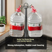 Two large plastic bottles with red labels on a metal stand in a kitchen setting.