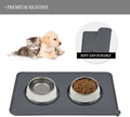Pet mat with two bowls, one with water and one with kibble, featuring a puppy and kitten on a white background.