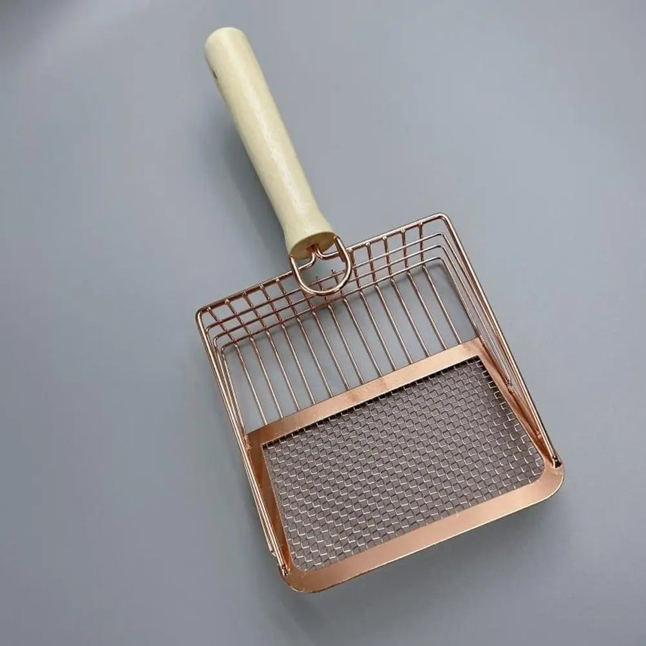 Metallic pet scoop with a beige handle on a gray background