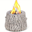 Log-shaped fire pit with flames on a white background