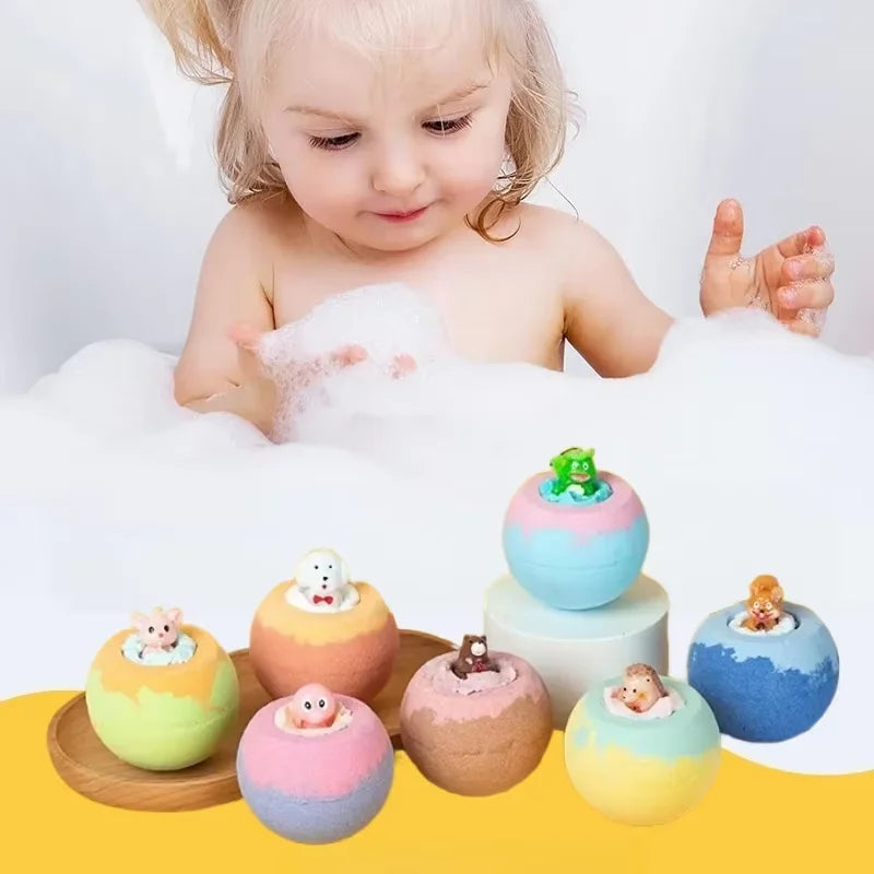 Child playing with colorful bath bombs featuring small figures in a bathtub filled with bubbles.