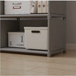 Storage boxes on a shelf with a neutral background