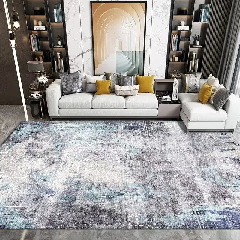 Living room with a modern sofa, decorative pillows, and a patterned rug.