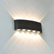 Black wall-mounted outdoor light fixture on a gray background