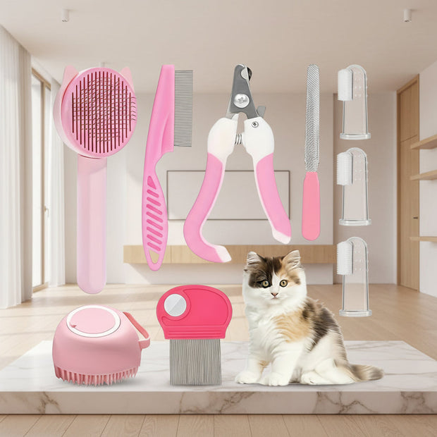 Set of pet grooming tools with a cat sitting below on a white background