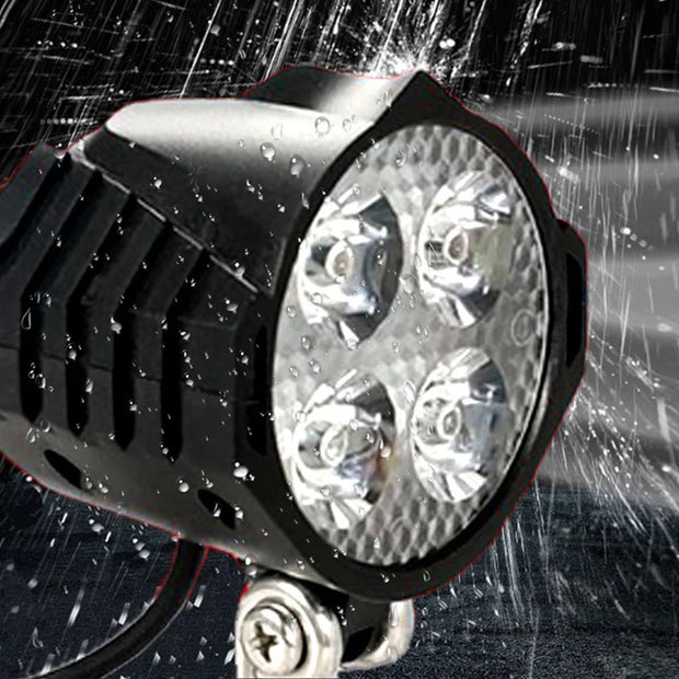 Waterproof LED light projector with water droplets on a dark background