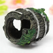 Decorative aquarium rock with a hollow center on a white background
