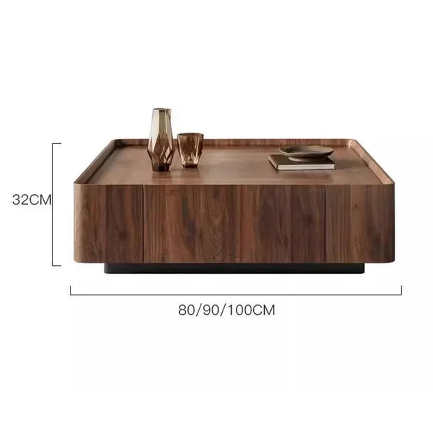 Wooden coffee table with decorative items and dimensions on a white background