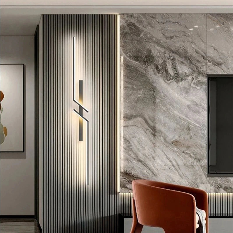 Modern interior design with a wall-mounted light fixture and marble wall.