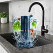 Blue kitchen appliance with fruits and vegetables on a white background