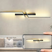 Modern wall lights with a smartphone displaying a similar design on a neutral background