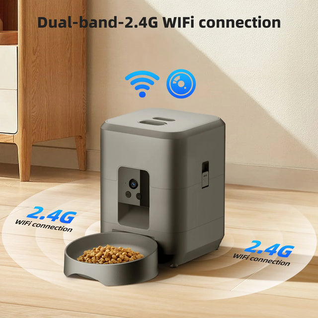 Gray automatic pet feeder with a bowl of food on a wooden floor, featuring dual-band 2.4G WiFi connection text.