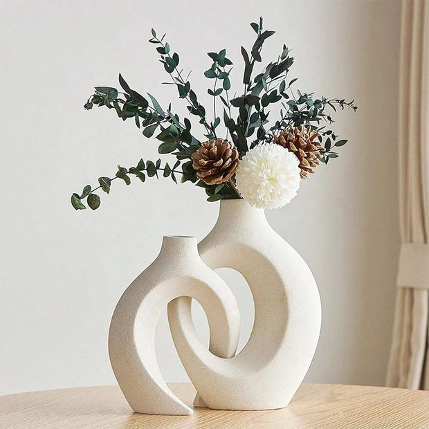 Decorative vase with floral arrangement on a wooden surface