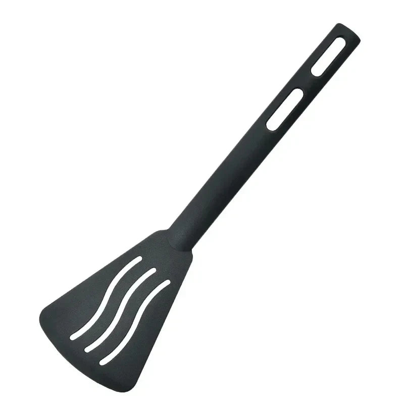 Black slotted spatula on a white background