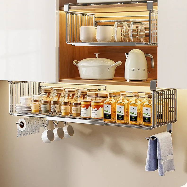 Kitchen cabinet with organized shelves containing jars, bottles, and kitchenware.