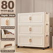 White storage cabinet with gold handles on a neutral background, showing dimensions and features.