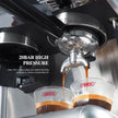 Coffee being brewed into a glass with a visible Hibrew logo, featuring 20bar high pressure.