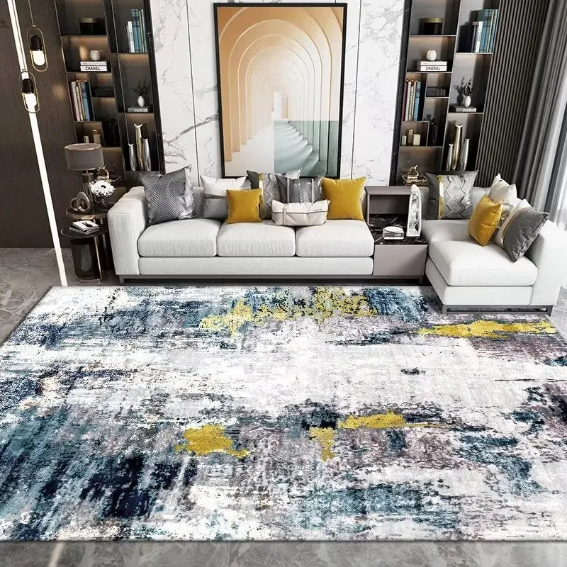 Modern living room with a patterned rug, sofa, and decorative pillows.