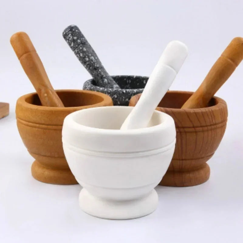 Set of mortar and pestle with different materials on a white background