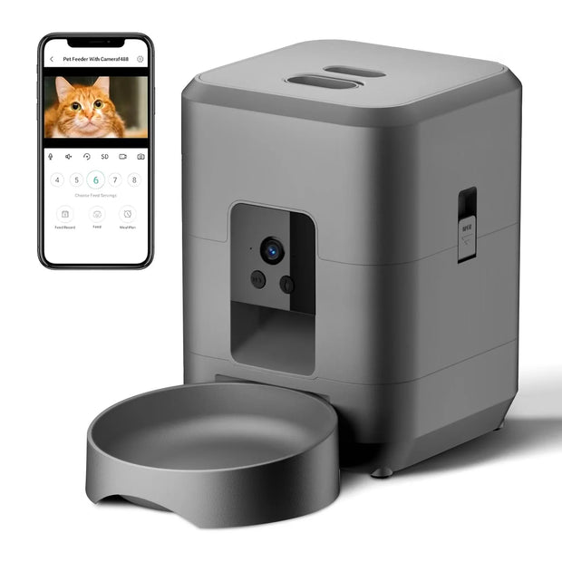 Gray pet feeder with bowl and smartphone displaying app interface on a white background