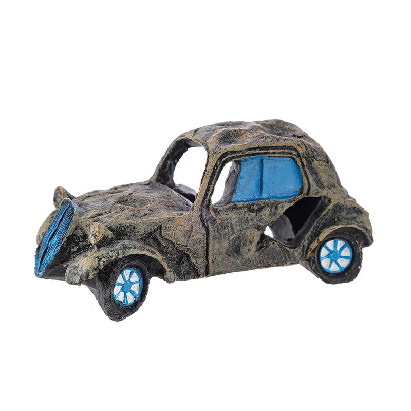 Small model car with blue interior and wheels on a white background