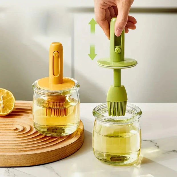Two silicone scrubbers, one yellow and one green, being used to clean jars on a marble surface.